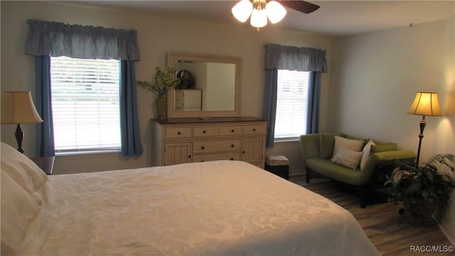 bedroom with ceiling fan and wood finished floors