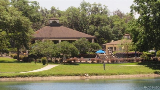 exterior space with a yard and a water view