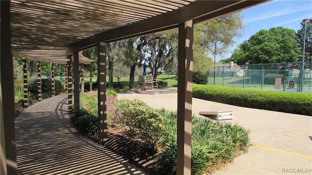 view of patio / terrace featuring fence and a pergola