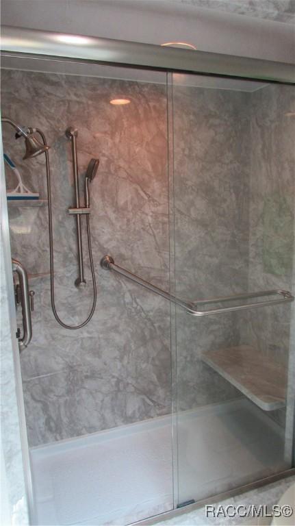 bathroom featuring a stall shower