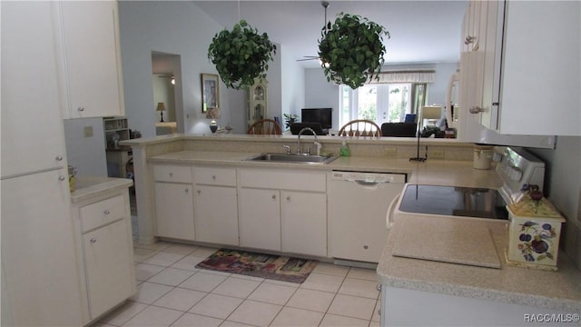 kitchen with white cabinets, a sink, dishwasher, light countertops, and range with electric cooktop