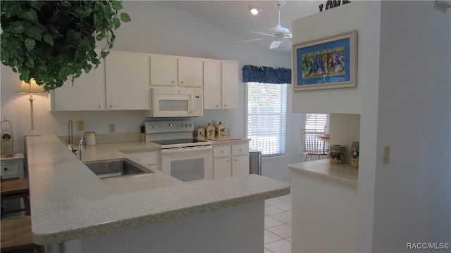 kitchen featuring a ceiling fan, white appliances, light countertops, a sink, and light tile patterned floors