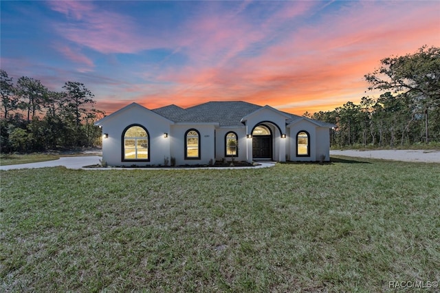 view of front of home with a yard