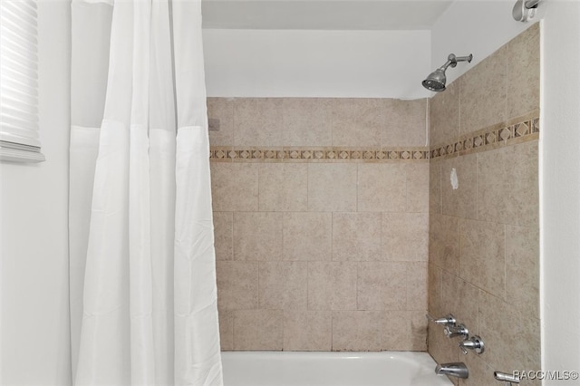 bathroom featuring shower / bath combination with curtain