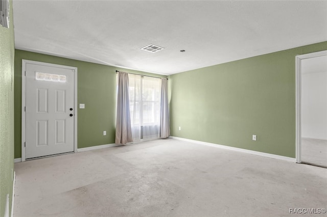 view of carpeted foyer