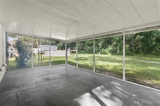 unfurnished sunroom featuring a wealth of natural light