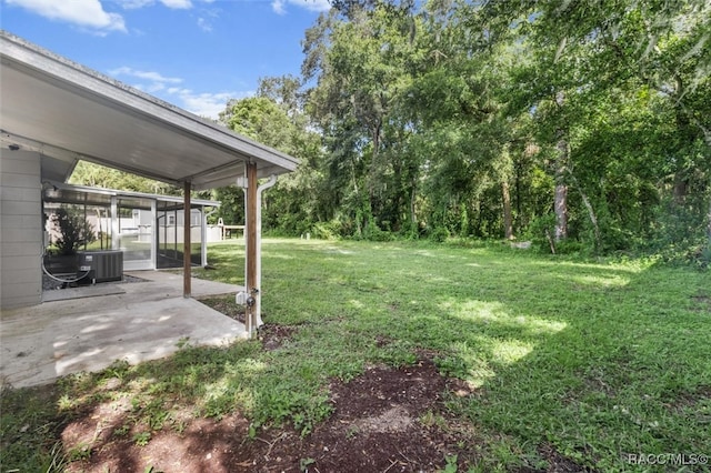 view of yard featuring a patio area and central AC unit