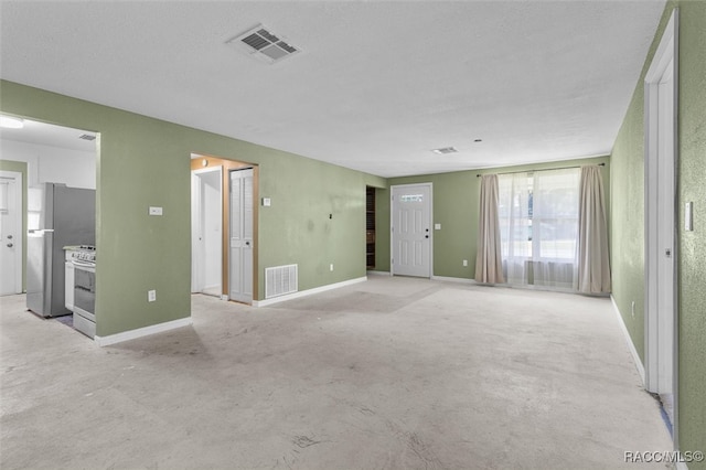 unfurnished living room with a textured ceiling