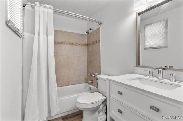 full bathroom with vanity, hardwood / wood-style floors, shower / bathtub combination with curtain, and toilet