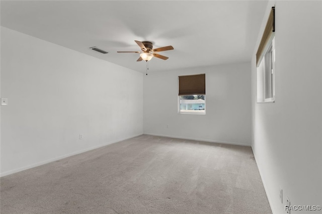 carpeted empty room with ceiling fan