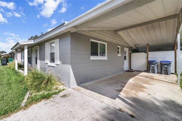 exterior space with a carport