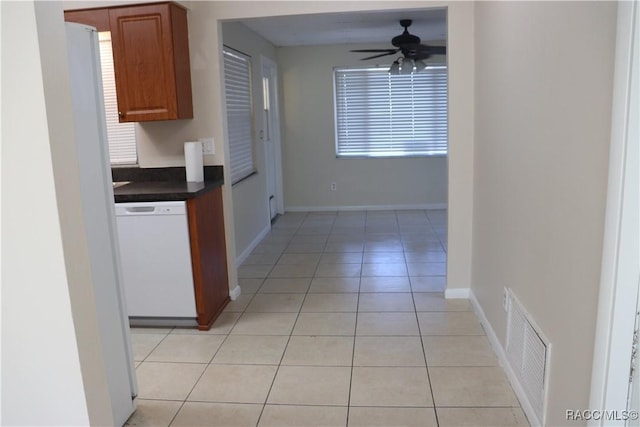 kitchen with dishwasher, light tile patterned floors, and ceiling fan