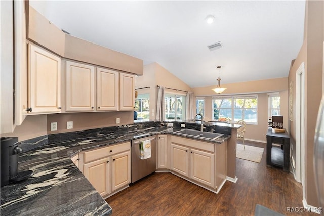 kitchen featuring kitchen peninsula, sink, pendant lighting, dark stone countertops, and dishwasher