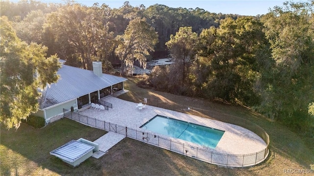 view of swimming pool with a lawn and a patio area