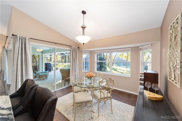 dining room with dark hardwood / wood-style floors and vaulted ceiling