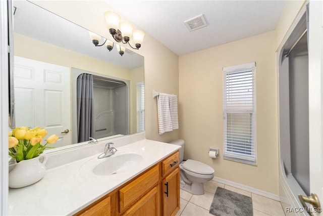 full bathroom with tile patterned floors, bathing tub / shower combination, vanity, and toilet