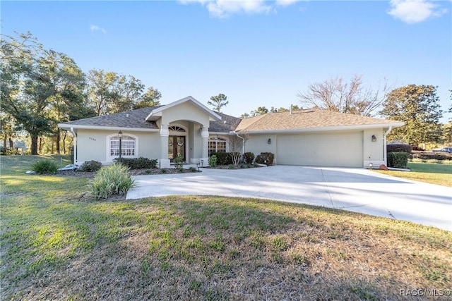 ranch-style home featuring a front yard and a garage