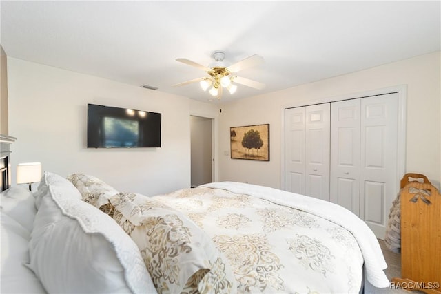 bedroom featuring ceiling fan and a closet