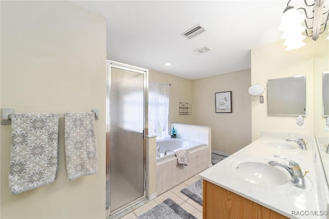 bathroom featuring tile patterned flooring, vanity, and independent shower and bath