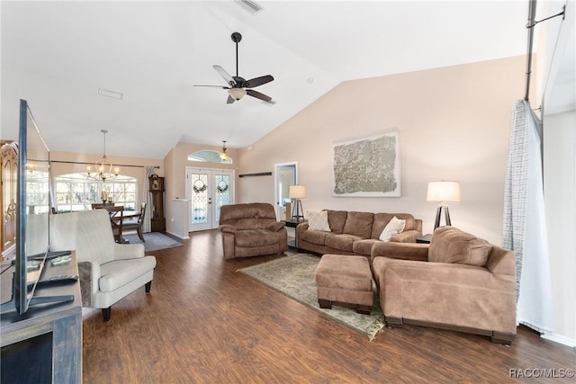 living room featuring dark hardwood / wood-style flooring, french doors, ceiling fan with notable chandelier, and lofted ceiling