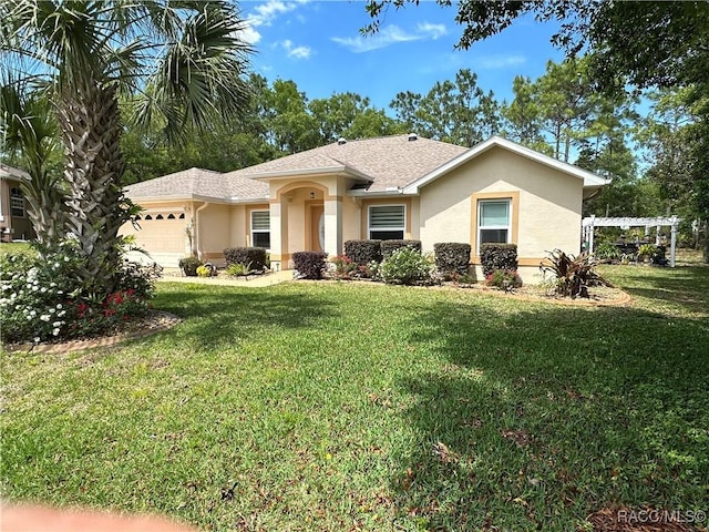 view of front facade featuring a garage and a front yard