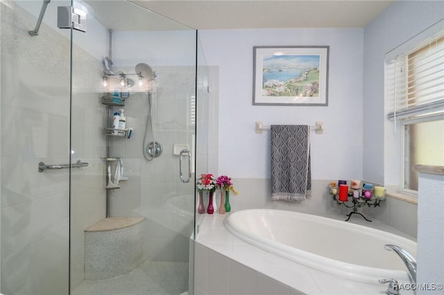 bathroom with shower with separate bathtub