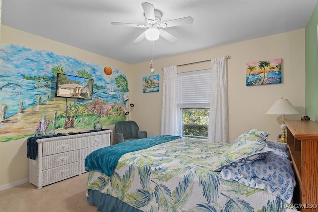 bedroom featuring light carpet and ceiling fan