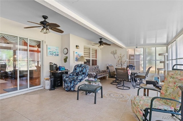 sunroom featuring ceiling fan