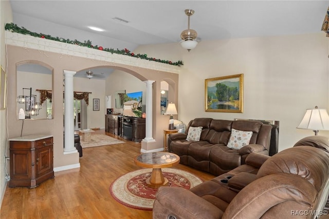 living room featuring ornate columns, ceiling fan, light hardwood / wood-style flooring, and lofted ceiling