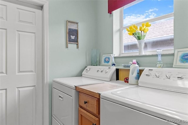 laundry room with washing machine and dryer