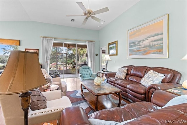 living room with ceiling fan, wood-type flooring, and vaulted ceiling