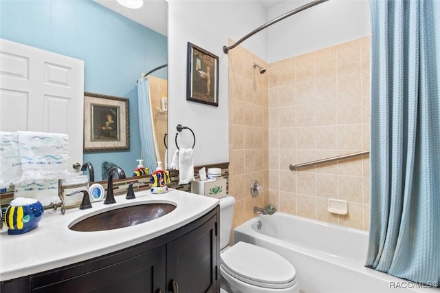 full bathroom featuring shower / bath combination with curtain, vanity, and toilet