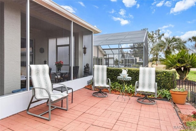 view of patio / terrace with glass enclosure