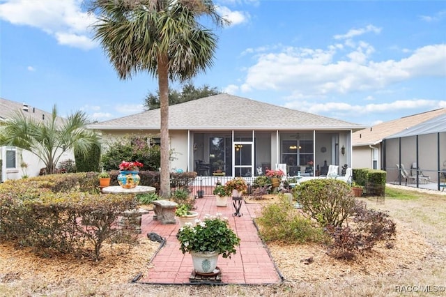 back of property featuring a sunroom