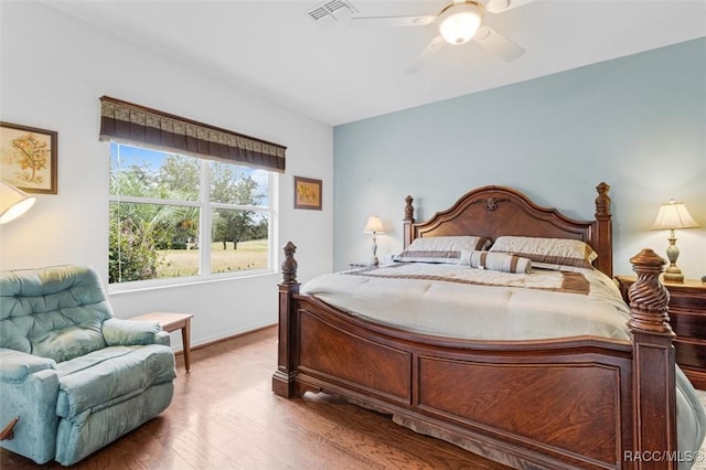 bedroom featuring hardwood / wood-style flooring and ceiling fan