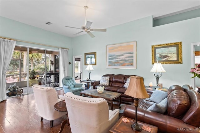 living room featuring wood-type flooring and ceiling fan