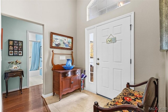 foyer entrance with light tile patterned floors