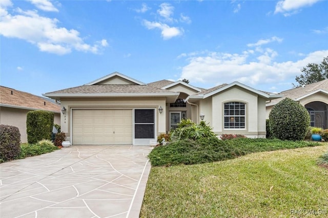 ranch-style home featuring a garage and a front lawn