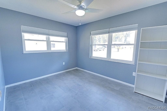 empty room featuring ceiling fan