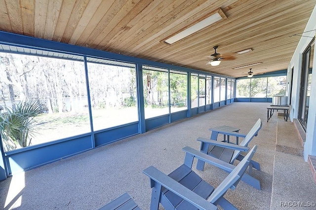 unfurnished sunroom with wood ceiling