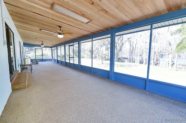 unfurnished sunroom with wooden ceiling