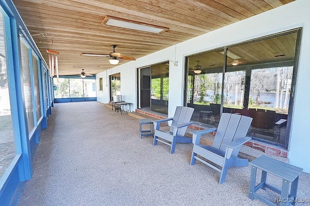 sunroom featuring wood ceiling