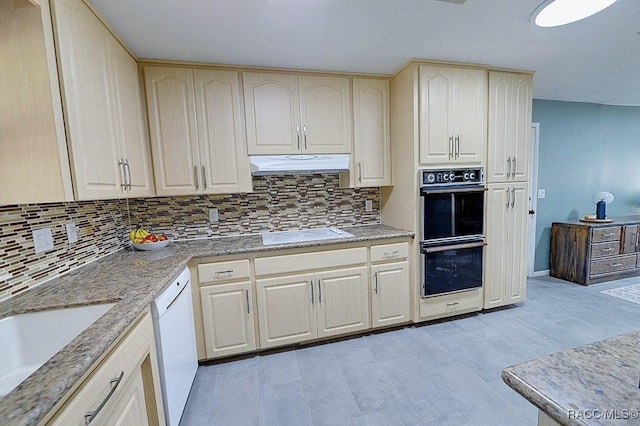 kitchen with white appliances, sink, and backsplash