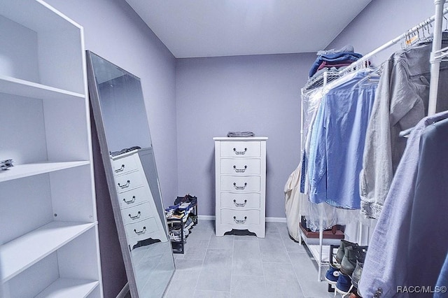 spacious closet with light tile patterned flooring