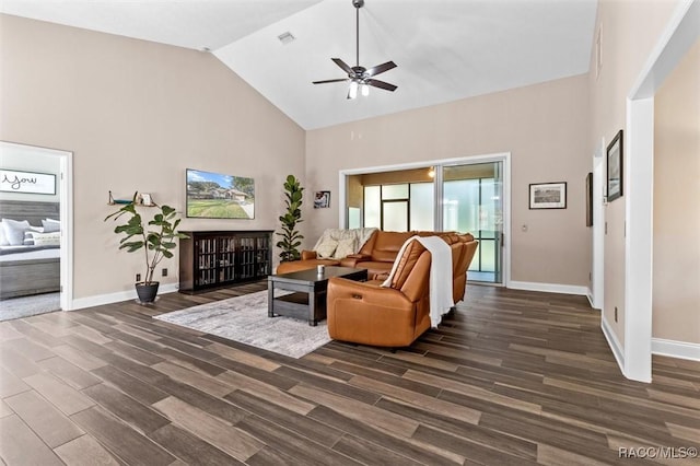 living room featuring ceiling fan, dark wood-type flooring, and high vaulted ceiling