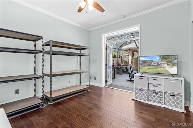 interior space featuring ceiling fan, crown molding, and dark wood-type flooring