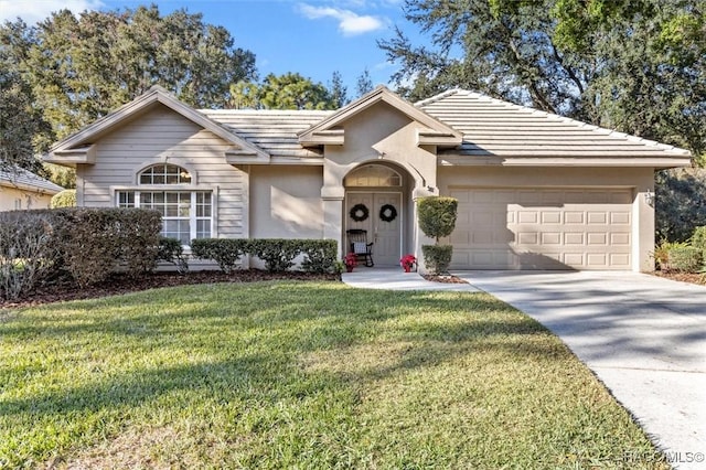 single story home with a garage and a front yard