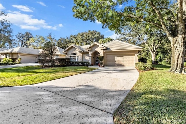 ranch-style house featuring a front yard and a garage