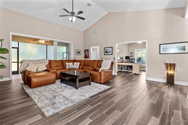 living room with dark hardwood / wood-style floors, high vaulted ceiling, and ceiling fan