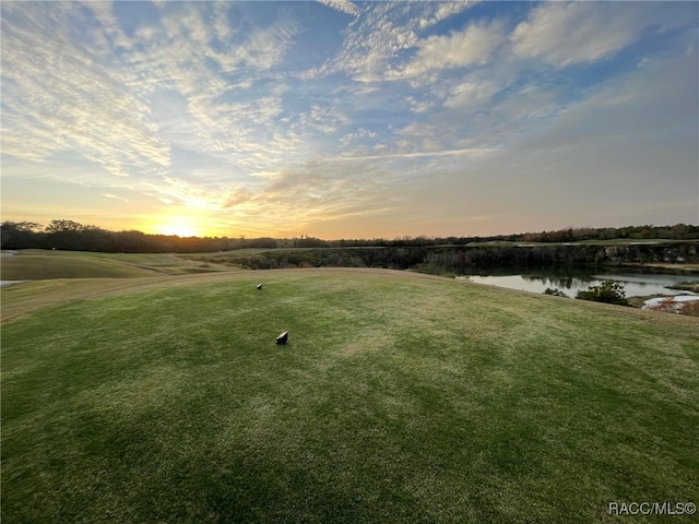 yard at dusk with a water view